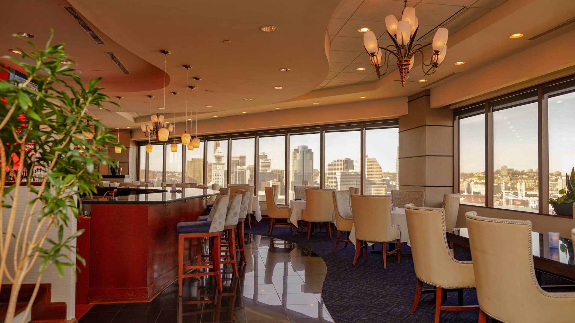 Best 360-degree panoramic view of Cincinnati skyline at the Metropolitan Club with white chairs and bar